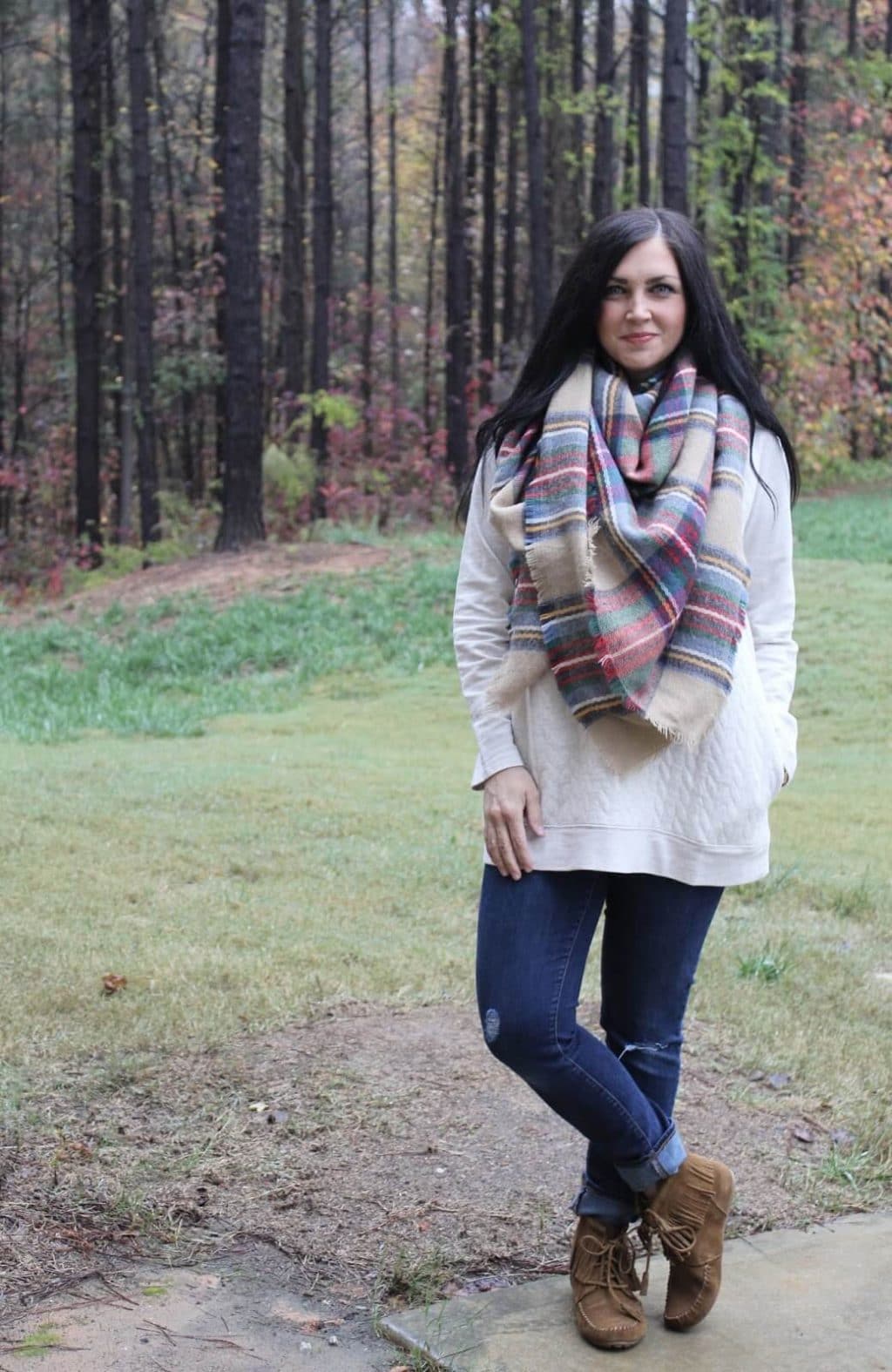 Quilted sweatshirt, plaid blanket scarf, fringe boots