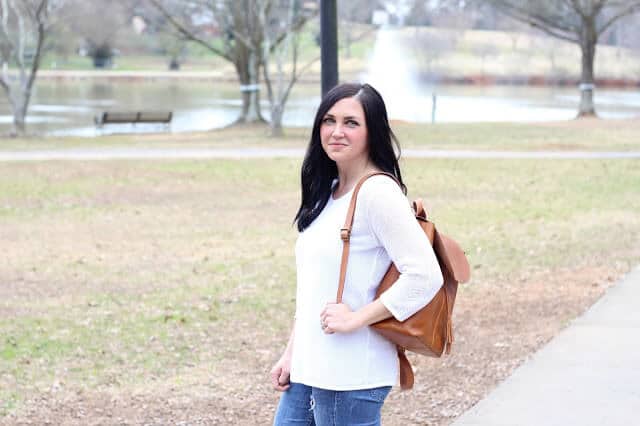 White sweater, cognac backpack, skinny distressed jeans. @Jjillstyle