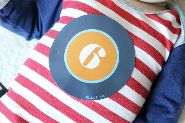 6 month sticker onesie via Bella Tunno