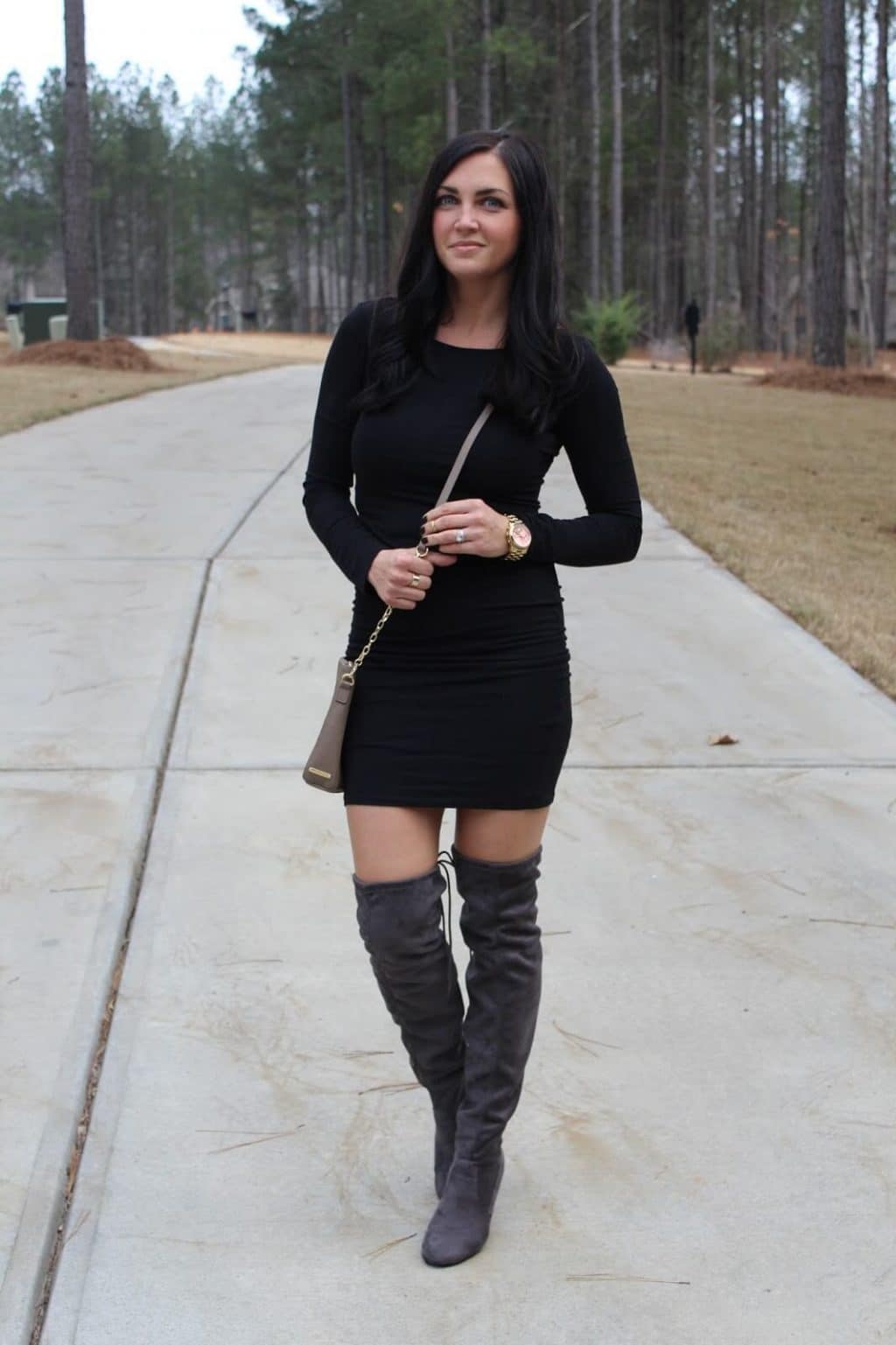 black bodycon dress with knee high boots and dresses