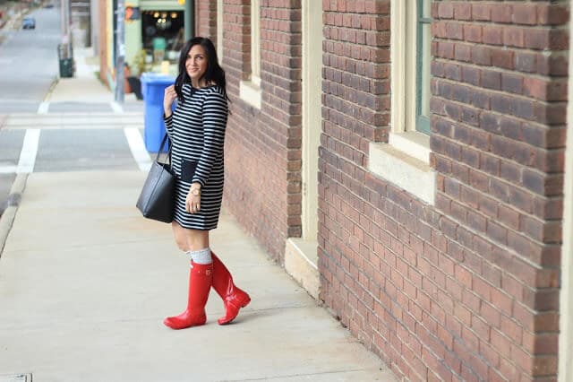 Black and grey stripe dress with red Hunter Boots 