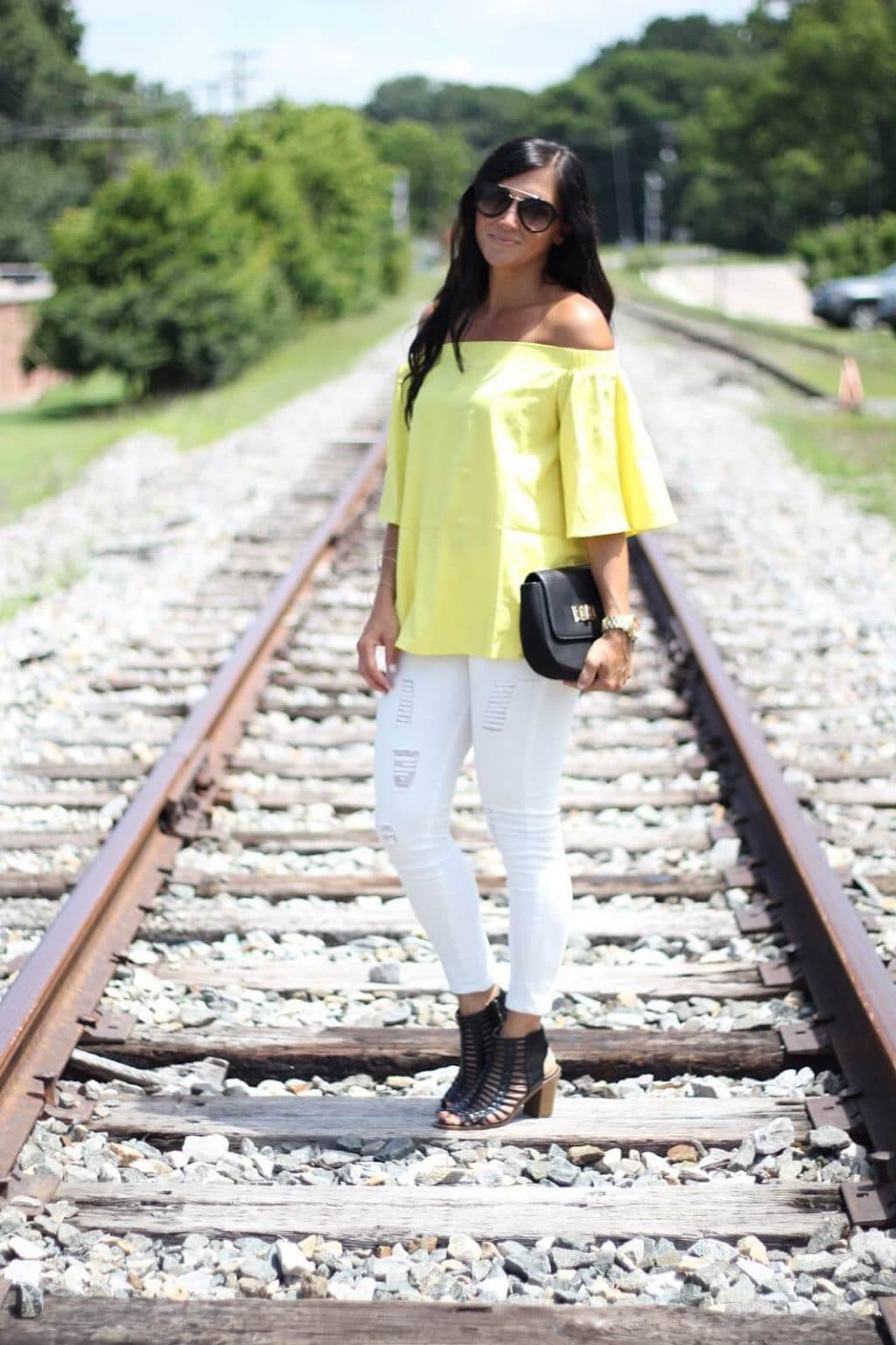 Yellow off the shoulder, white distressed jeans, summer style, stilettos and diapers