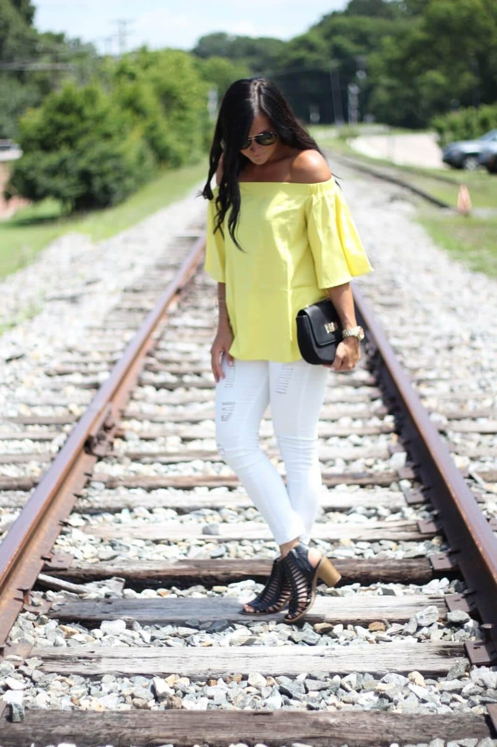 Yellow off the shoulder, white distressed jeans, summer style, stilettos and diapers