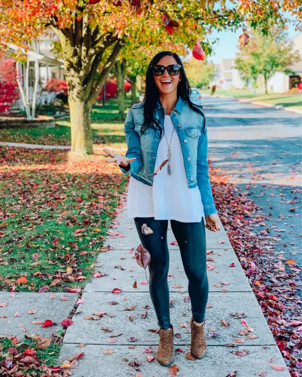 tunic sweater with black Spanx leggings and printed booties